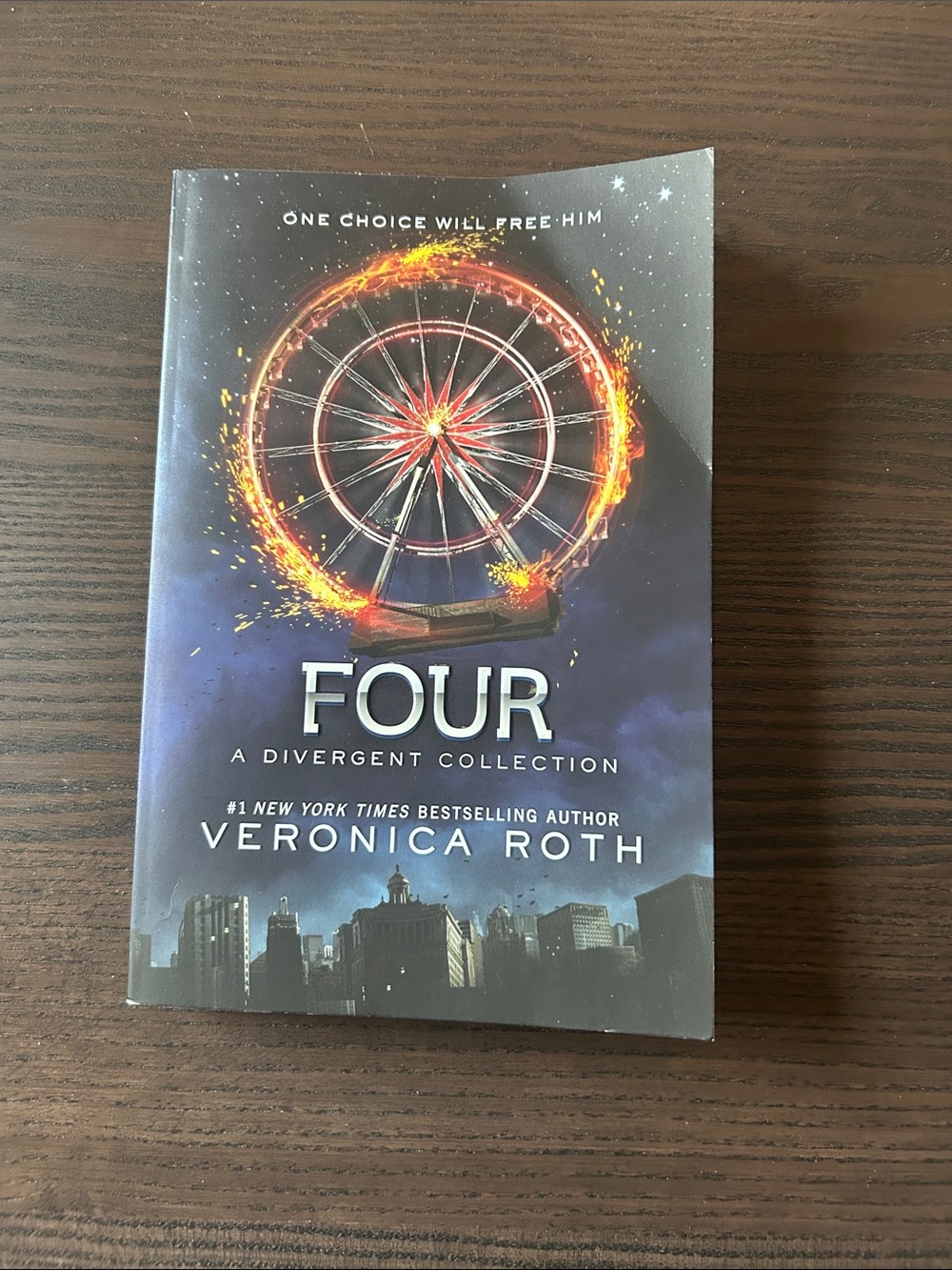 Four by Veronica Roth Paperback - Dark Blue Cover with Fiery Wheel